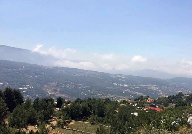 Land with a mountain view for sale in Tourzaya, Jbeil