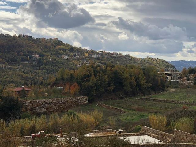 Land with a mountain view for sale in Kfarzebian, Keserwan
