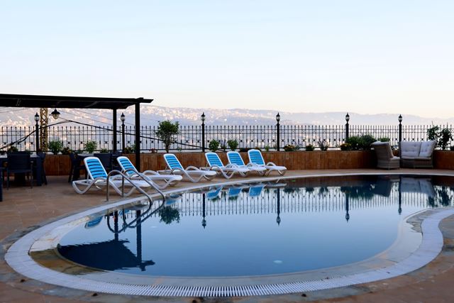 Building with a pool for rent in Bet Mery, Metn