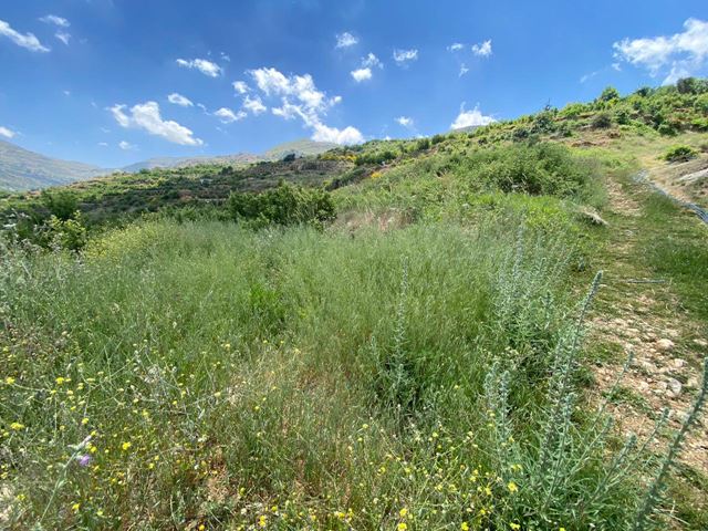 Land with a mountain view for sale in Kfarzebian, Keserwan